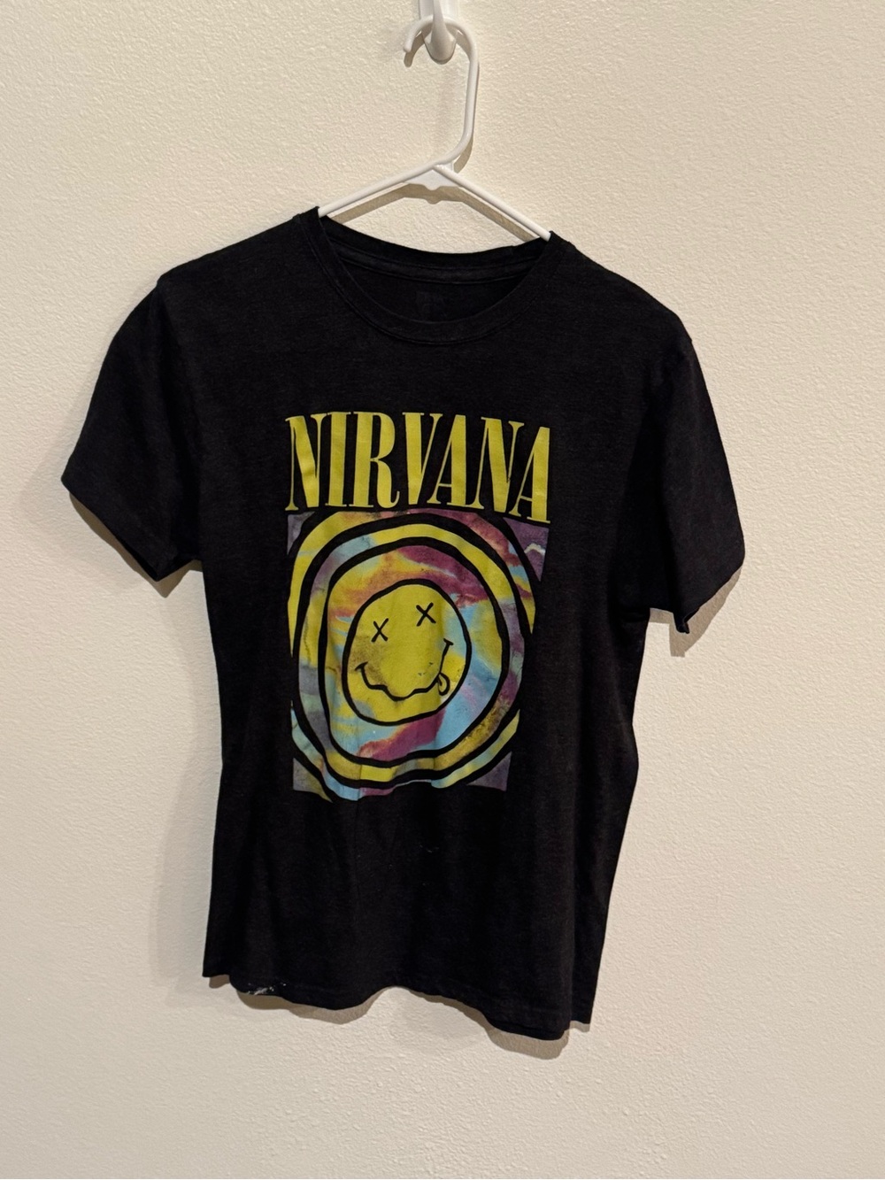 NIRVANA Black Tee with Yellow Logo and Multicolor Tie-Dye Smiley